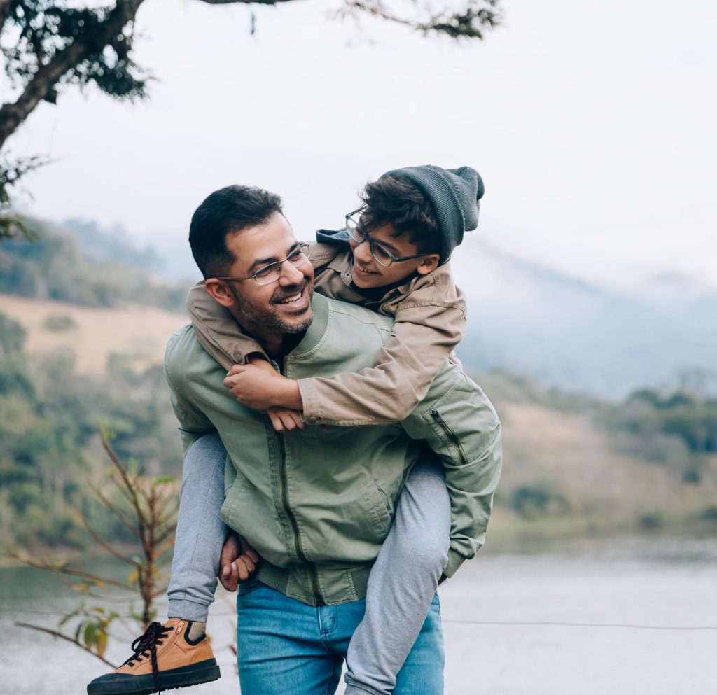 Man Carrying Child